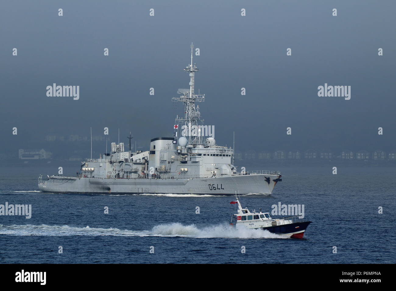 The Clydeport pilot boat Gantock, passing the French Navy frigate FS Primauguet D644 at Gourock on the Firth of Clyde. Stock Photo