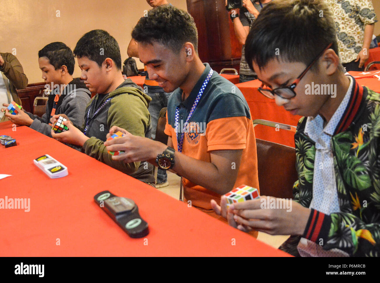 Quezon City, Philippines. 01st July, 2018. Rubik's cube participants in an open competition during the event. Credit: Robert Oswald Alfiler/Pacific Press/Alamy Live News Stock Photo