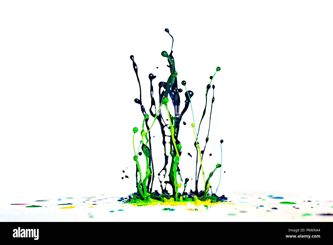 color dancing splashes of paint on a white background Stock Photo - Alamy