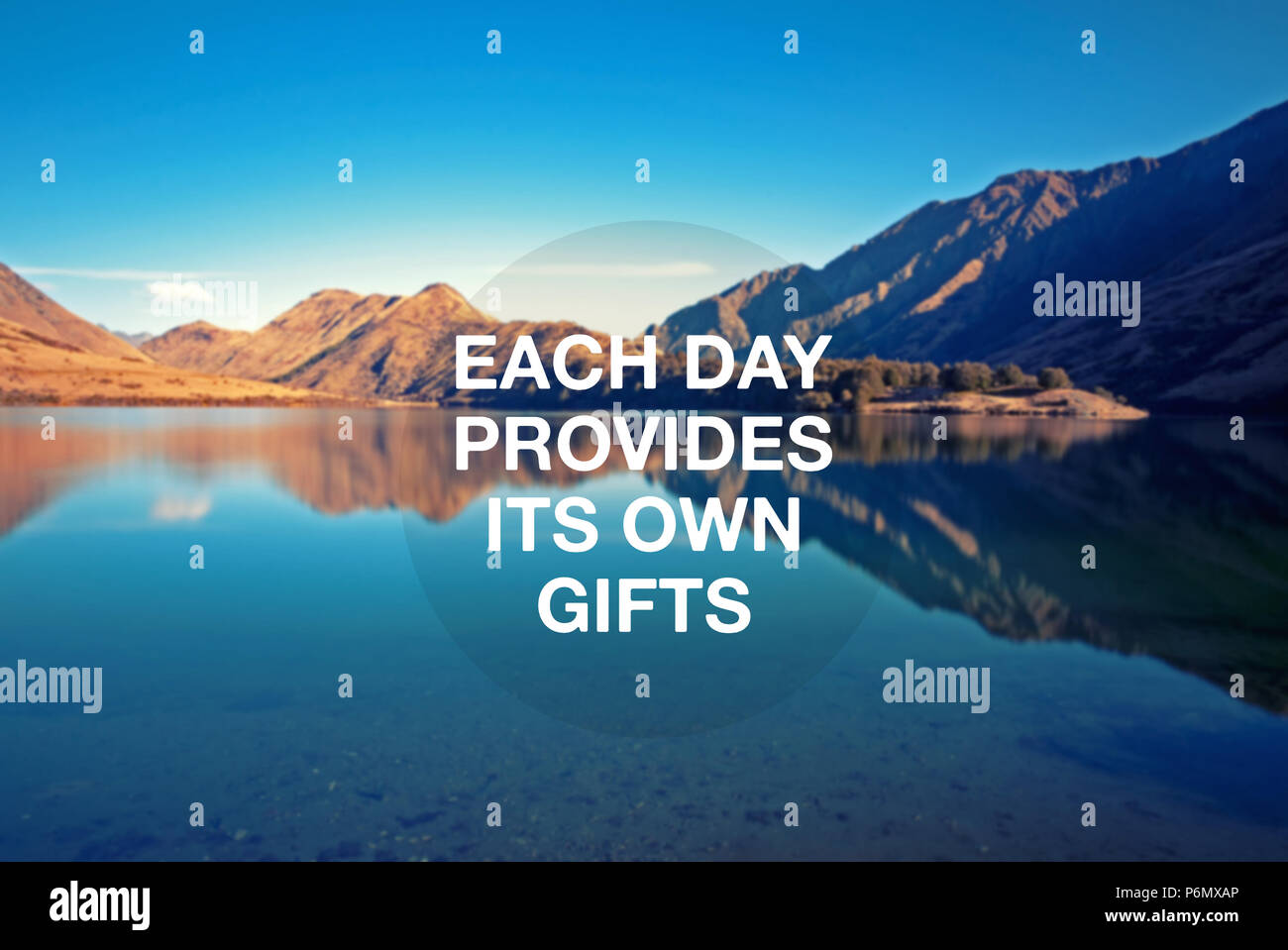 Motivational and inspirational quote - Each day provides its own gifts Stock Photo