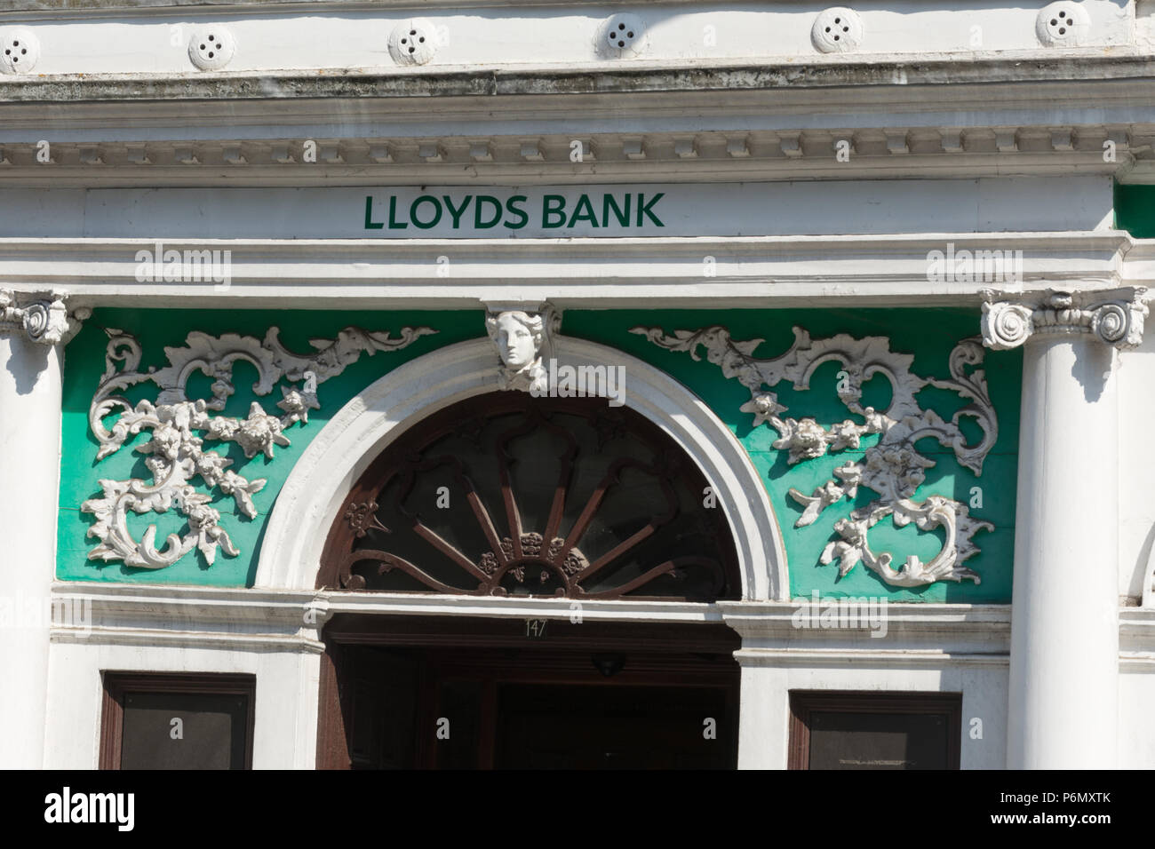 Detail of the decorative exterior of the Lloyds Bank branch on the high street in Guildford, Surrey, UK Stock Photo