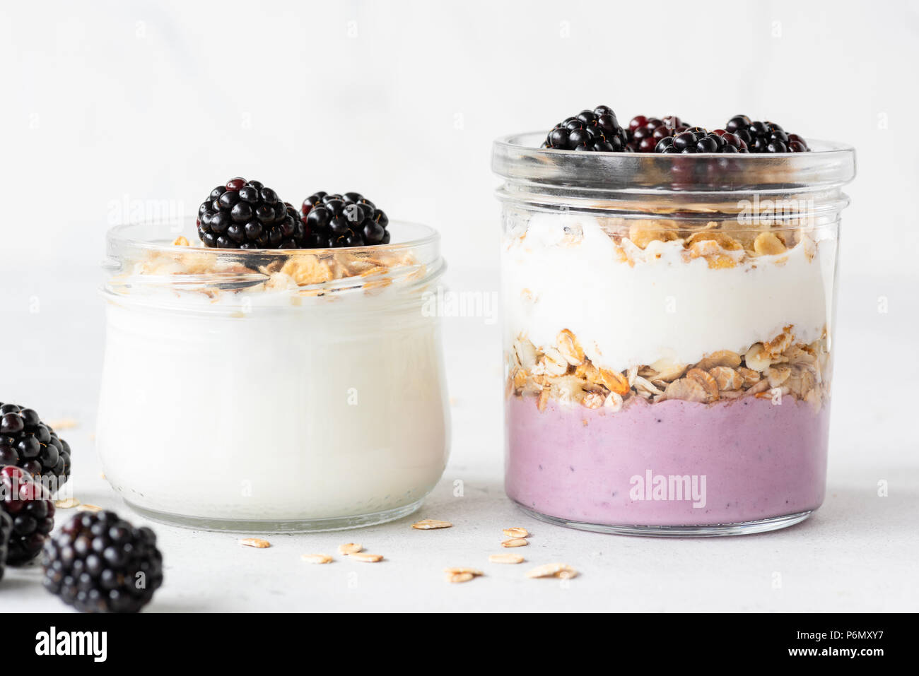 Overnight oats or healthy breakfast parfait with yogurt, granola and