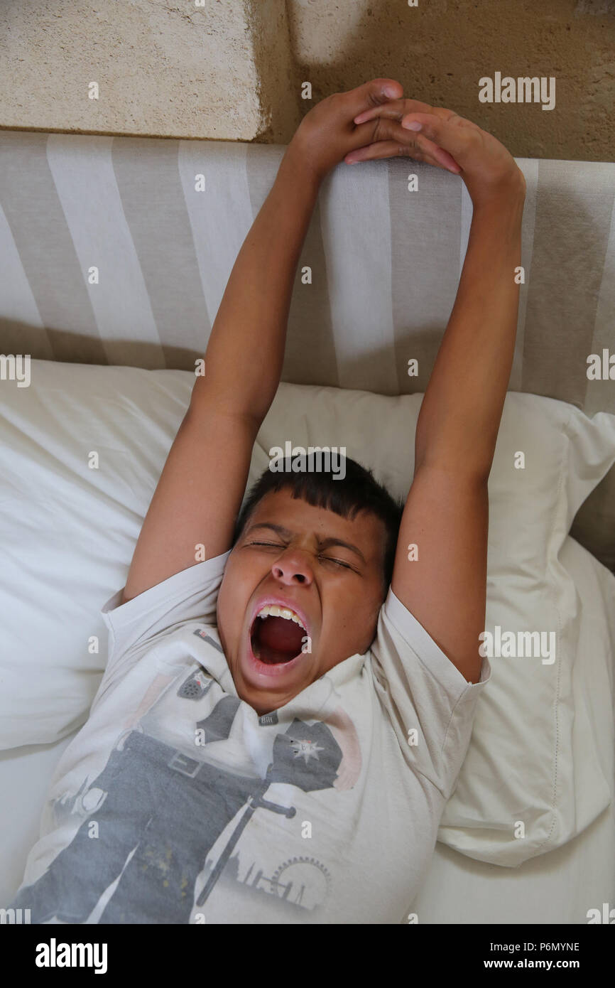 11-year-old boy waking up in Salento, Italy. Stock Photo