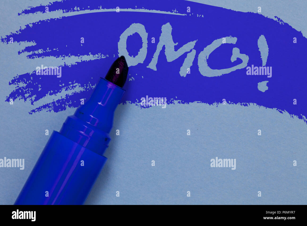 Writing note showing Omg Motivational Call. Business photo showcasing Oh my good abbreviation Modern Astonishment expression Bold blue marker colourin Stock Photo