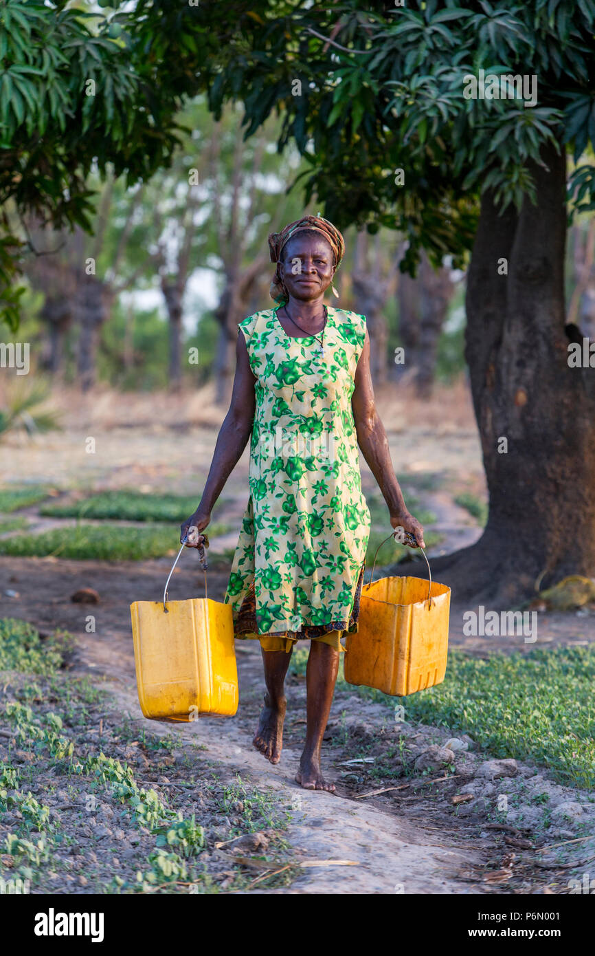 Carrying buckets of water hires stock photography and images Alamy