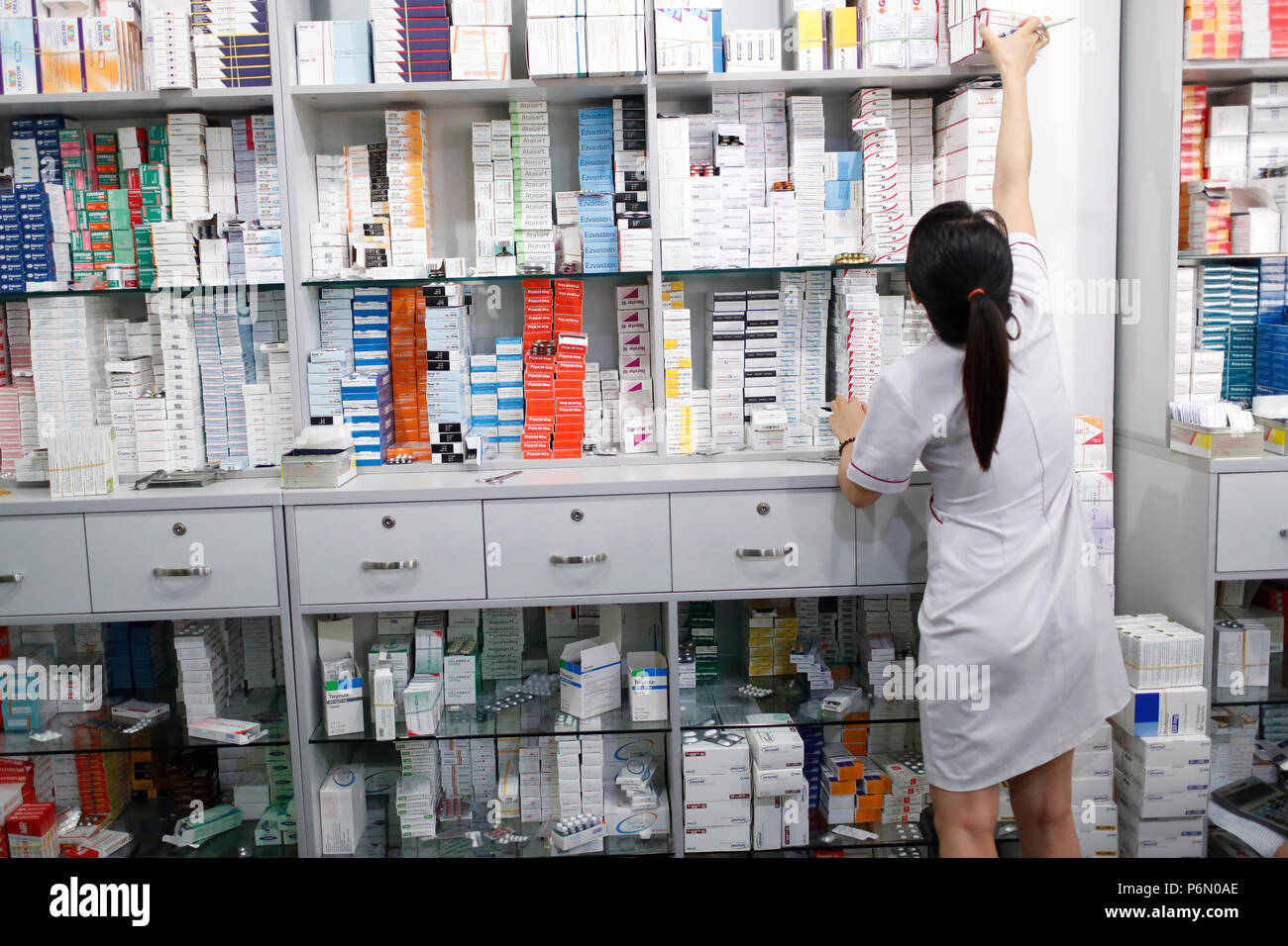 Hospital pharmacy.  Pharmacist checking inventory.  Ho Chi Minh City. Vietnam. Stock Photo