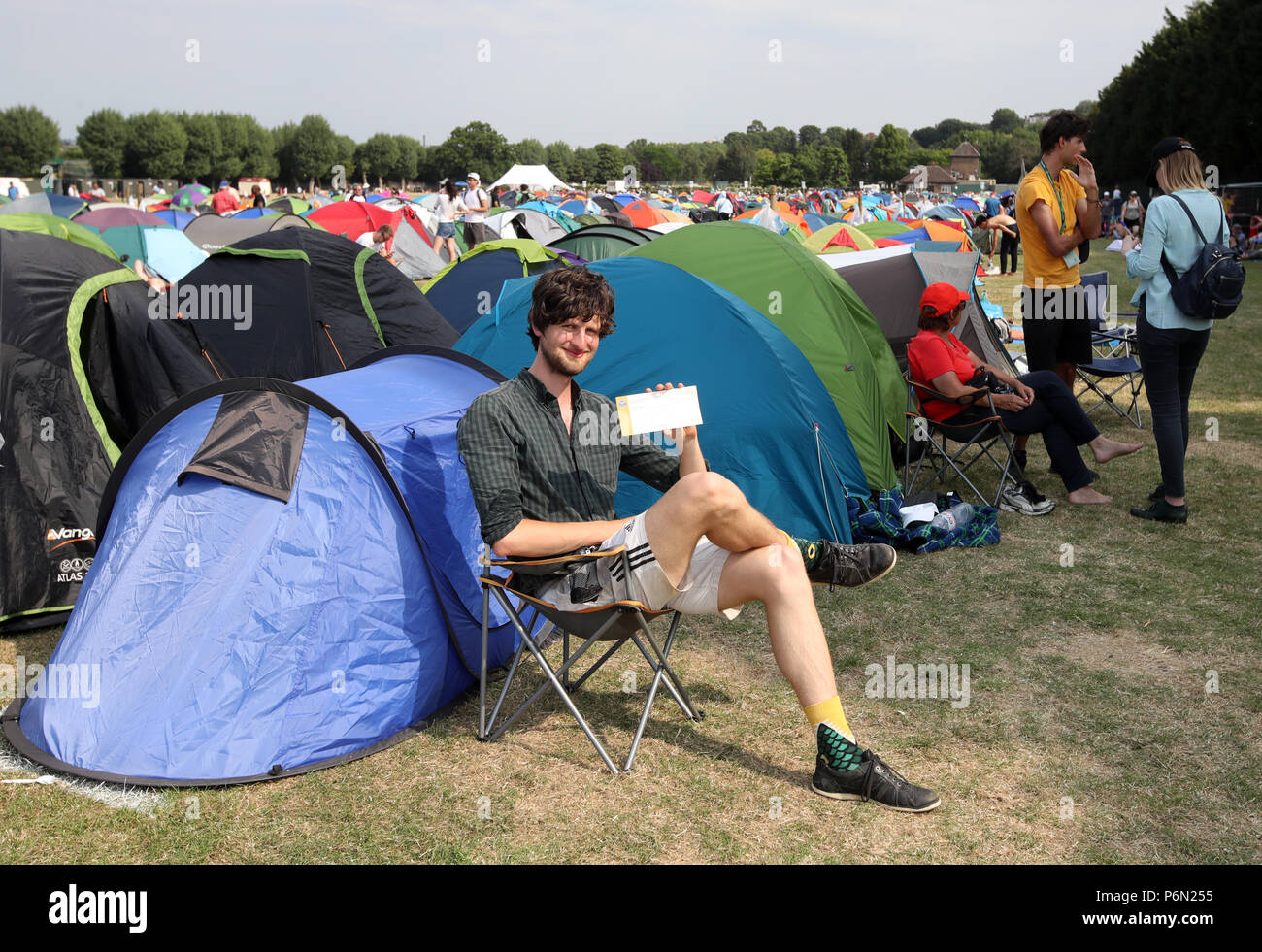 Darius Platt-Vowles from Gloucestershire is first in the queue ahead of the 2018 Wimbledon Championships at The All England Lawn Tennis and Croquet Club, Wimbledon.at the All England Lawn Tennis and Croquet Club, Wimbledon. Stock Photo
