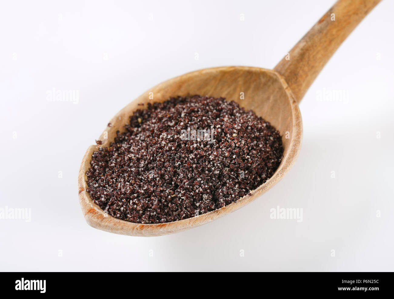 spoon of ground poppy seeds on white background Stock Photo