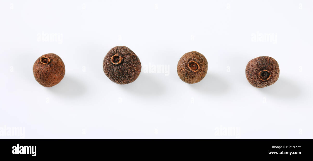 whole allspice berries on white background Stock Photo