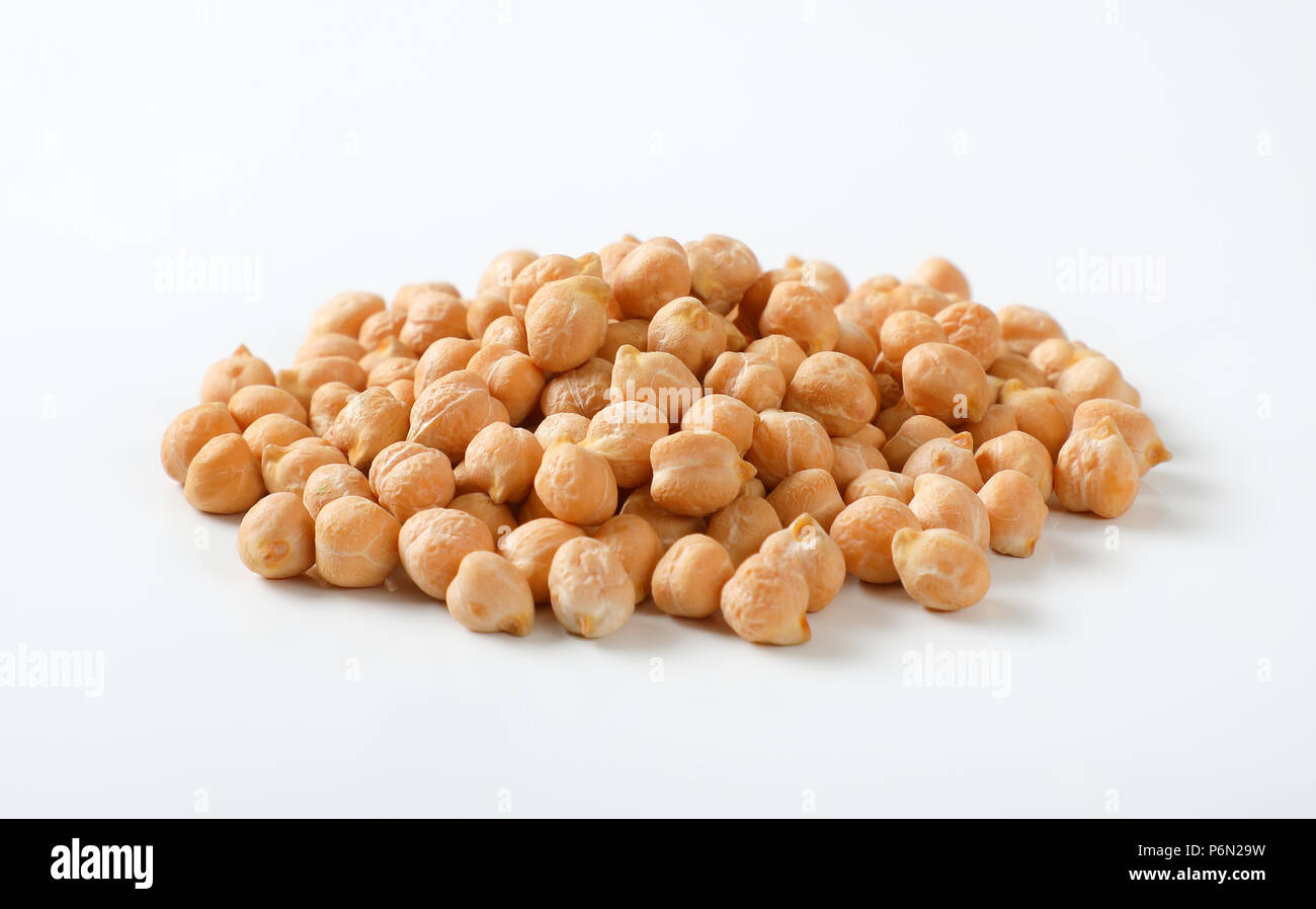 pile of raw chickpeas on white background Stock Photo