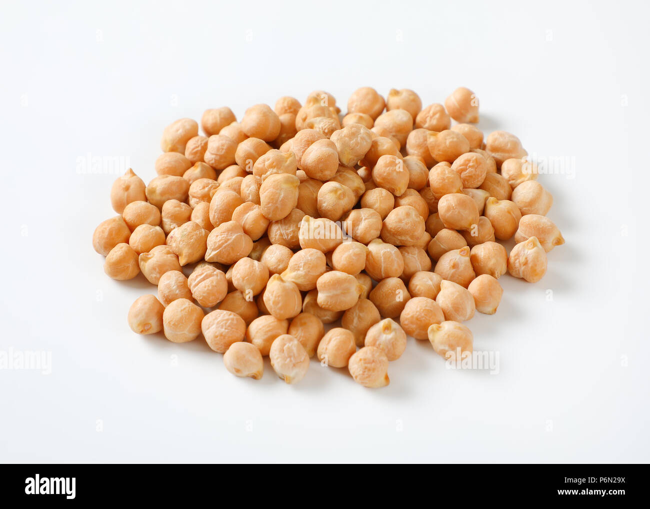 pile of raw chickpeas on white background Stock Photo