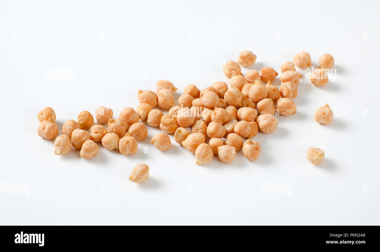 handful of raw chickpeas on white background Stock Photo