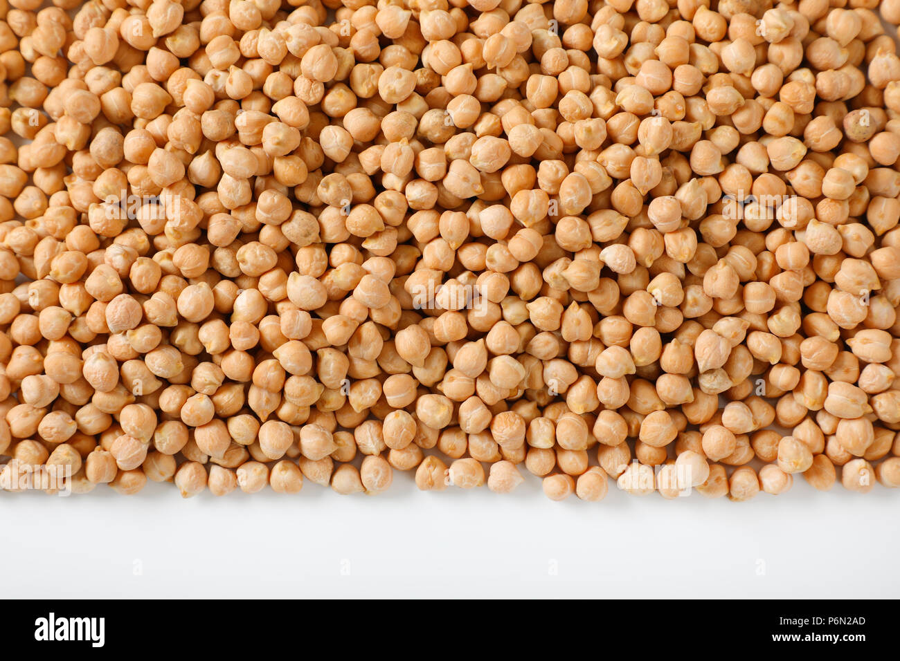 grains of raw chickpeas on white background Stock Photo