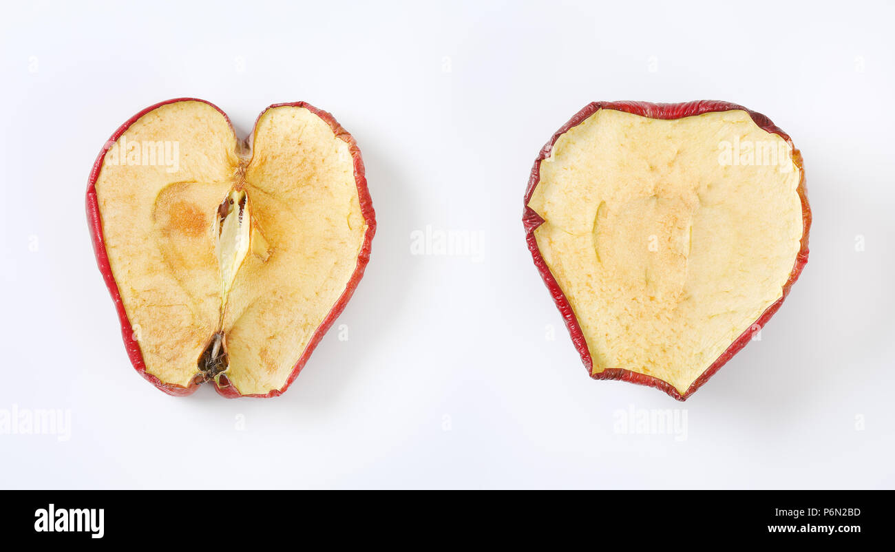 two dried apple halves on white background Stock Photo