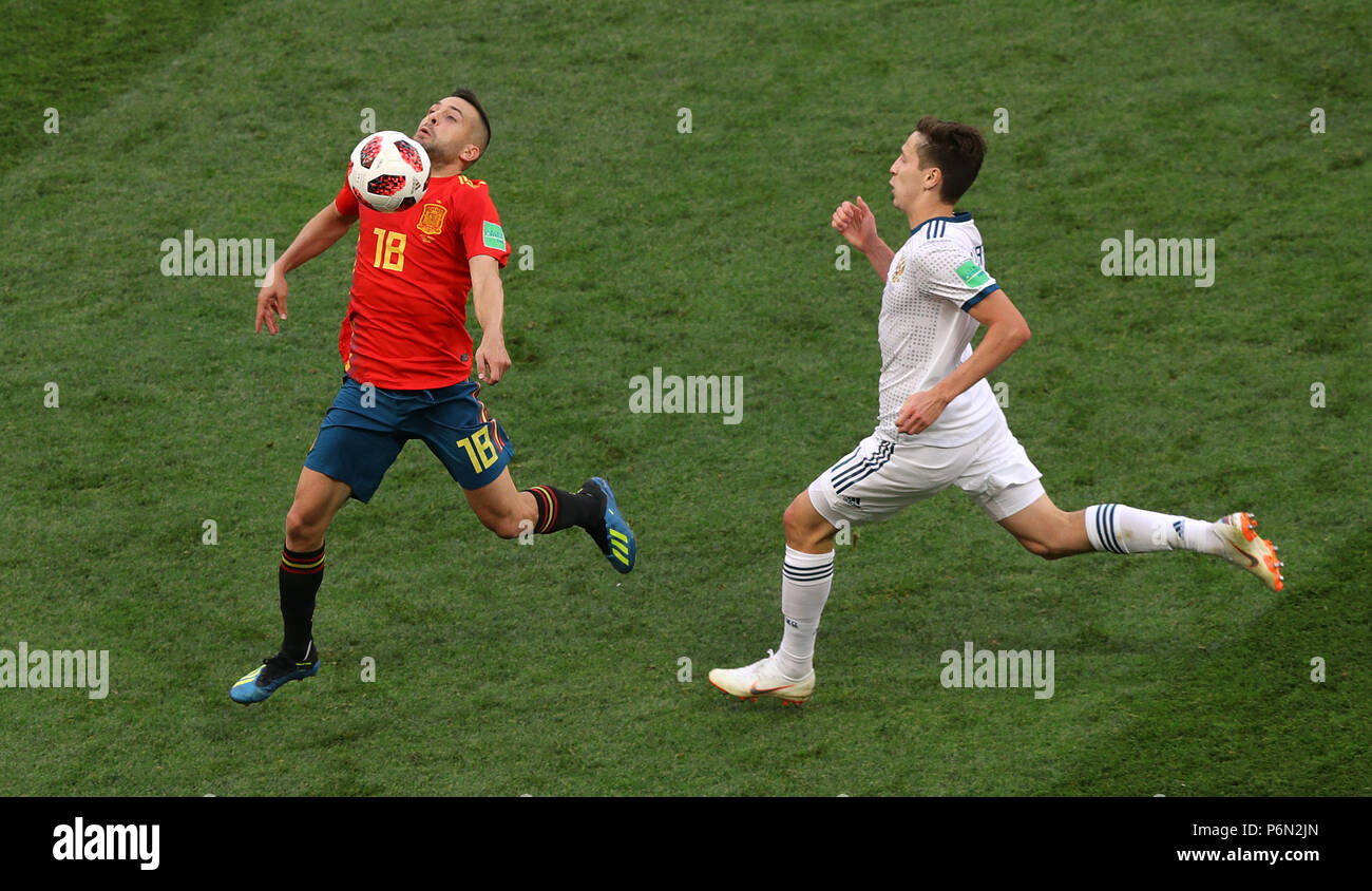 Spain's Jordi Alba (left) and Russia's Daler Kuzyayev during the FIFA World Cup 2018, round of sixteen match at The Luzhniki Stadium, Moscow. Stock Photo