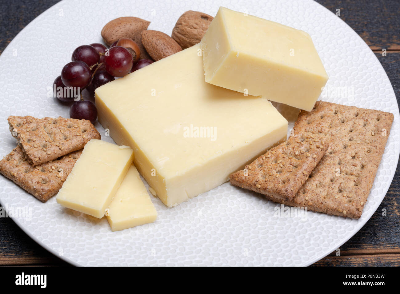 Block of aged cheddar cheese, the most popular type of cheese in United