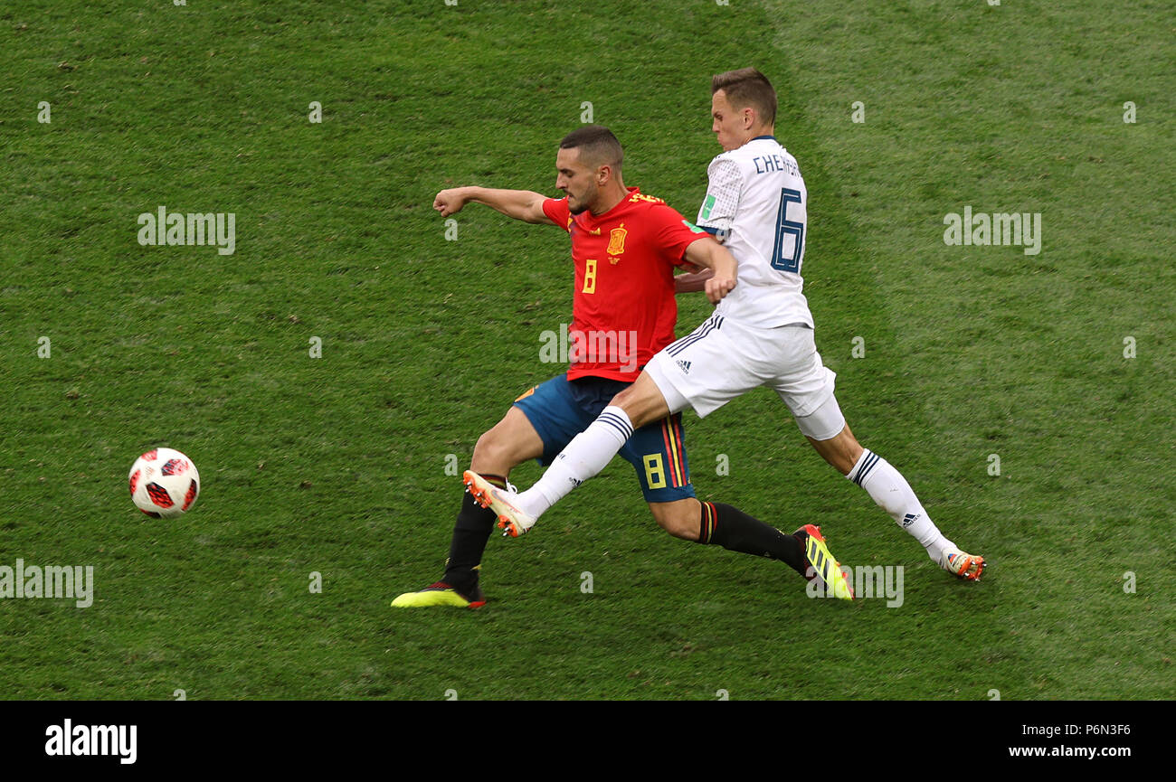 Spain's Koke (left) and Russia's Denis Cheryshev battle for the ball during the FIFA World Cup 2018, round of sixteen match at The Luzhniki Stadium, Moscow. Stock Photo