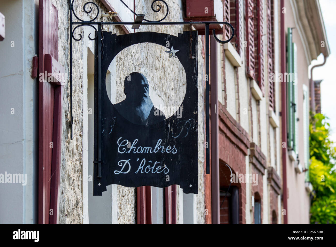 Sign showing silhouette of Impressionist painter Claude Monet at Le Coin des Artistes, chambre d'hôtes at Giverny, Eure department, Normandy, France Stock Photo