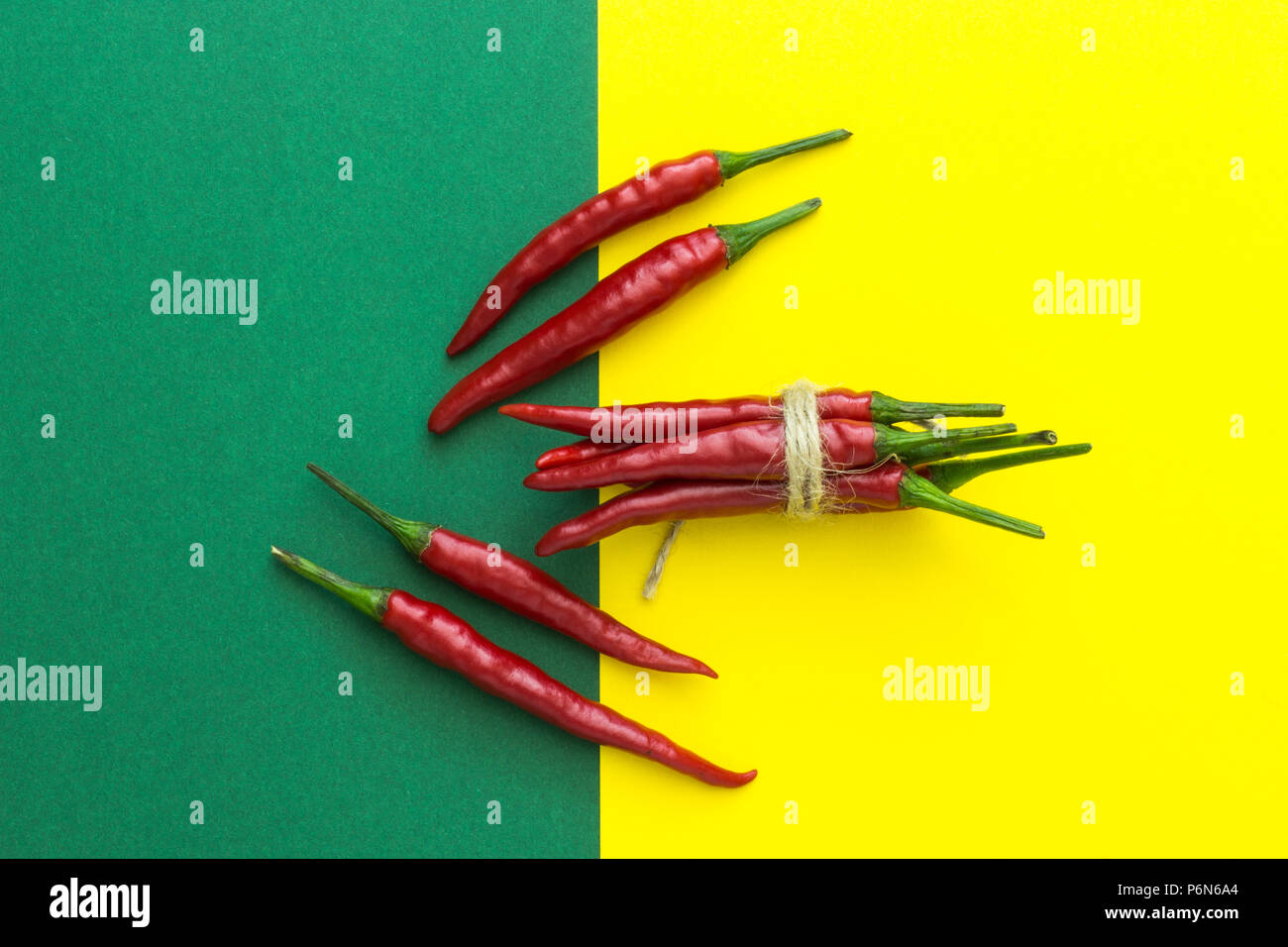 top view, lots of red chili peppers on a yellow-green background Stock ...