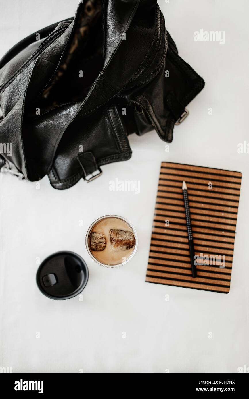 Iced coffee to go. Frozen coffee ice cubes in a vacuum flask poured with  milk. Thermos lid near the bottle. White background. Isolated, copy space  Stock Photo - Alamy