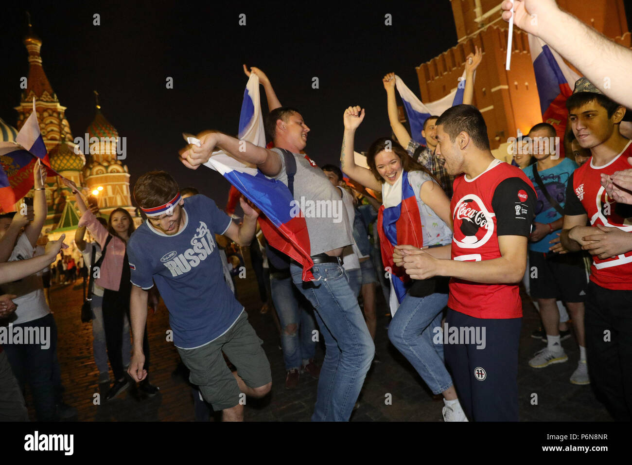 Carnival atmosphere as Russian fans near Red Square, Moscow celebrate their victory over Spain in the last 16 at the 2018 FIFA World Cup in, Russia. Stock Photo