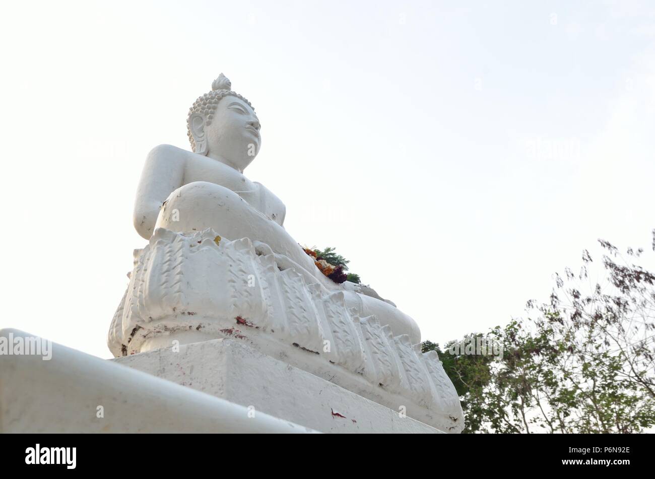 White Buddha statue and blue sky Stock Photo - Alamy
