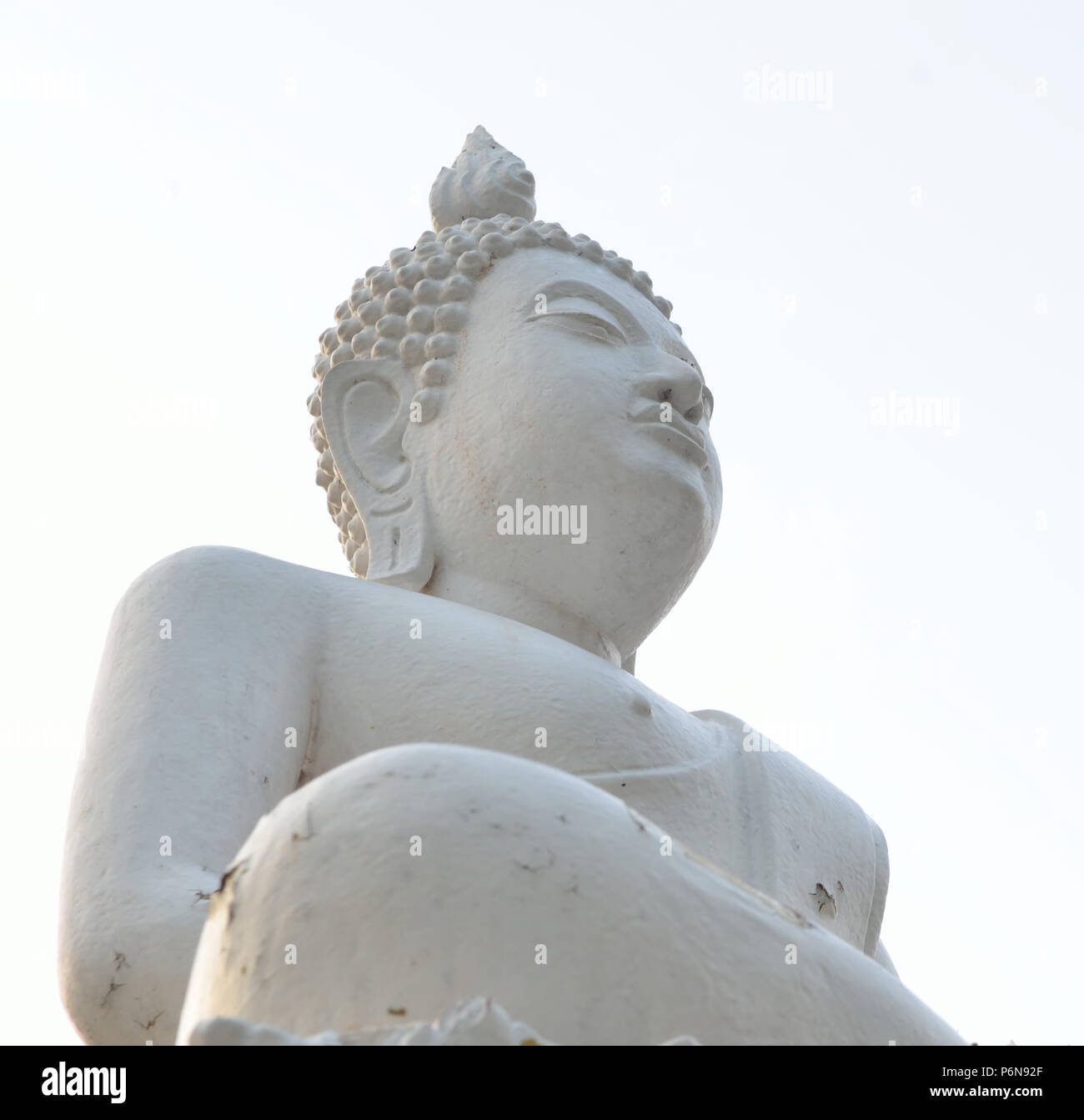 White Buddha statue and blue sky Stock Photo - Alamy