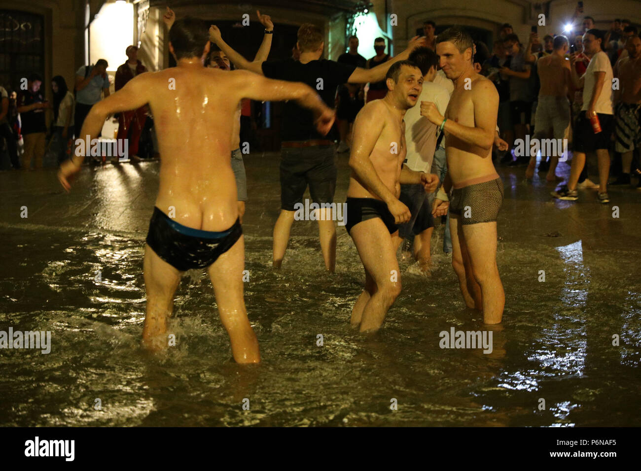 russian nudism  NOTE NUDITY Carnival atmosphere as Russian fans in a fountain near Red  Square, Moscow celebrate their victory over Spain in the last 16 at the  2018 FIFA World Cup in, Russia Stock