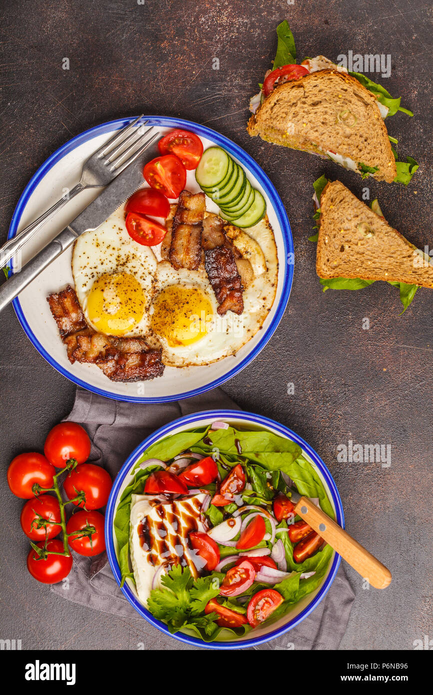 Food flat lay vegetable salad with goat cheese, sandwiches with cheese