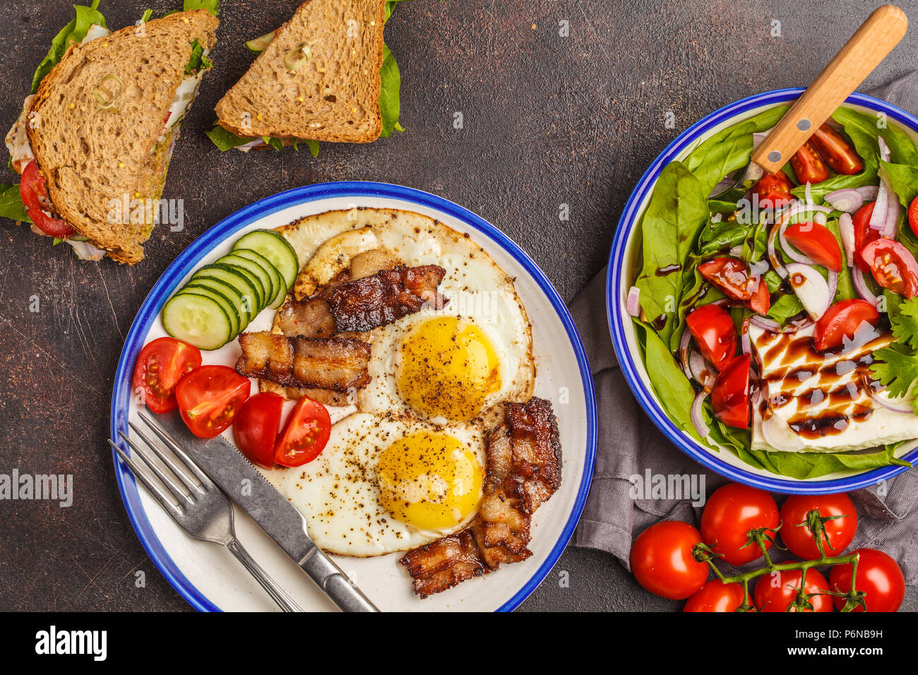Food flat lay vegetable salad with goat cheese, sandwiches with cheese