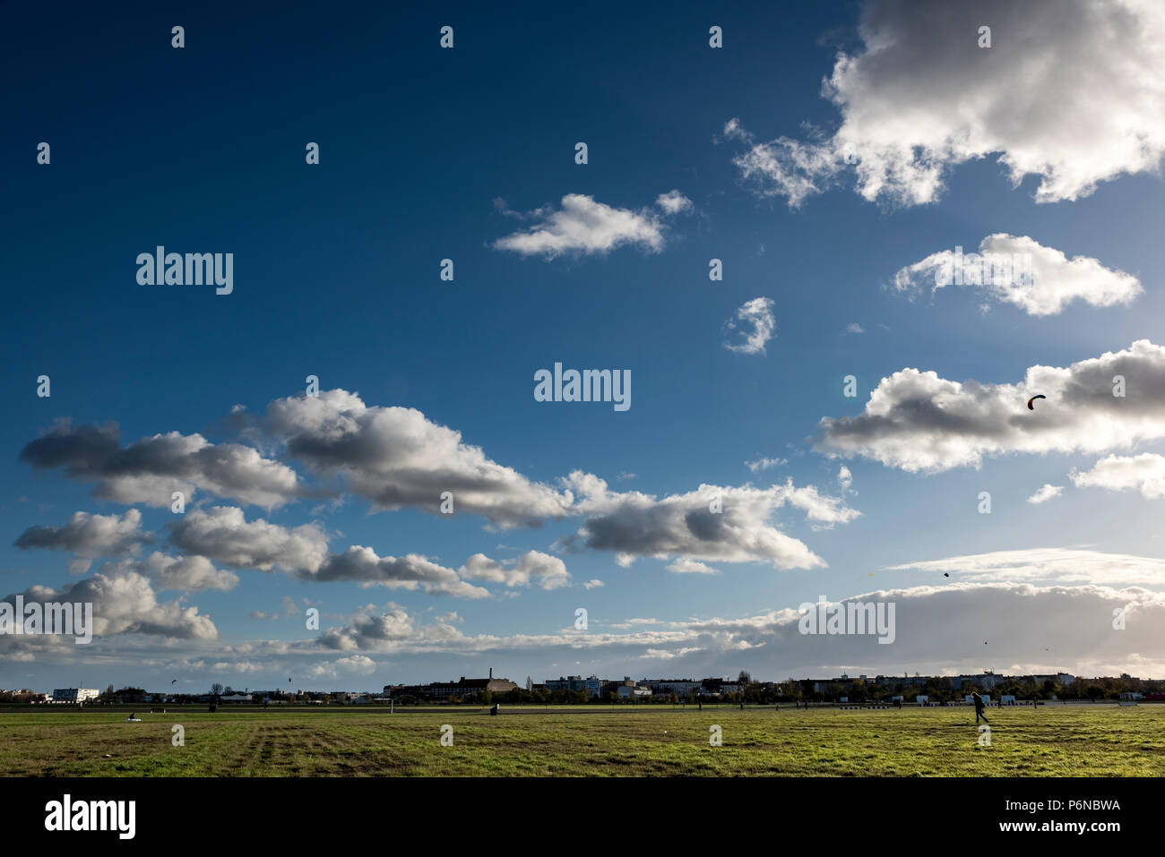 BERLIN, GERMANY, OCTOBER 20, 2017: Cloudscape view on Tempelhof Fields in Berlin with unidentified visitors. Stock Photo