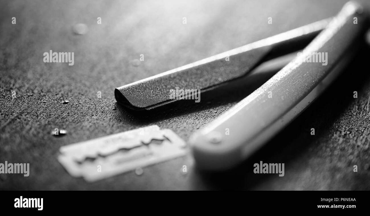 Unsafe Razorblade Brutal treatment Black and White Stock Photos & Images - Alamy