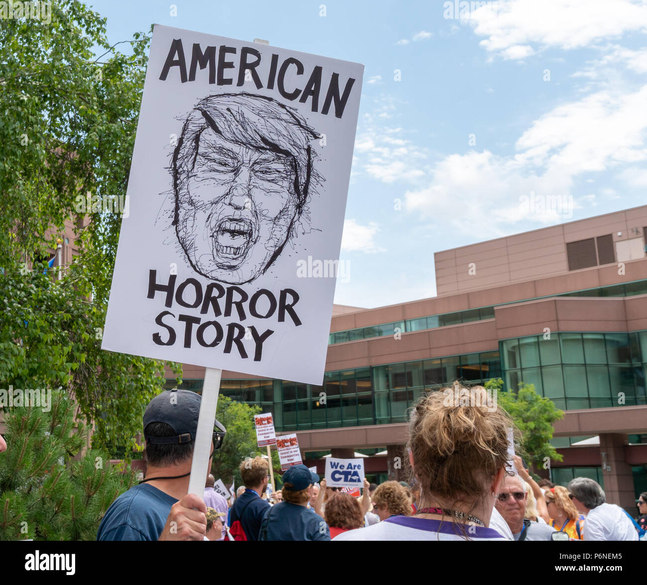 MINNEAPOLIS, MN/USA - JUNE 30, 2018: Unidentified individuals participating in the Families Belong Together march. Stock Photo