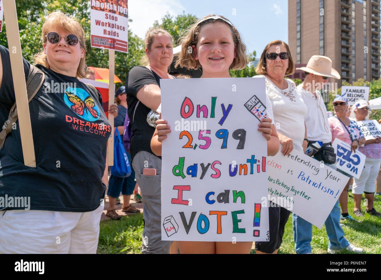 MINNEAPOLIS, MN/USA - JUNE 30, 2018: Unidentified individuals participating in the Families Belong Together march. Stock Photo