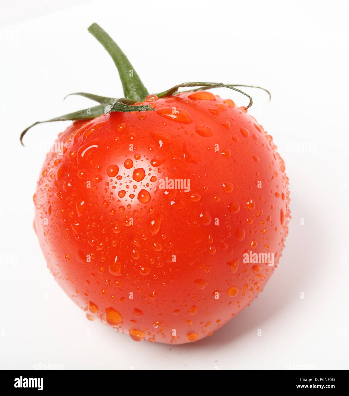 tomato with water drops on the white background Stock Photo - Alamy