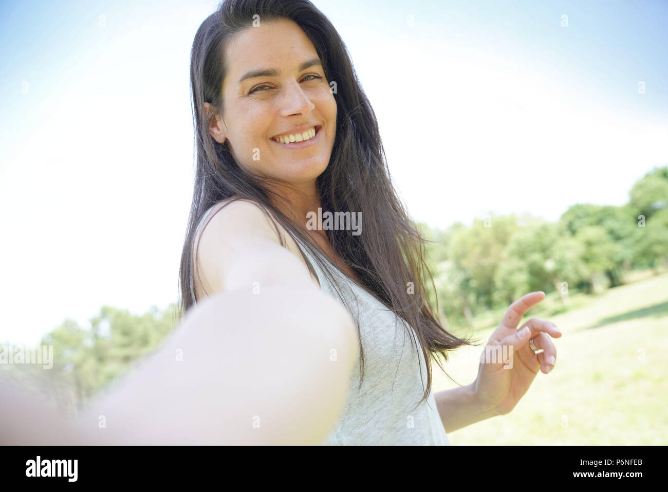 Portrait of smiling beautiful brunette woman Stock Photo - Alamy