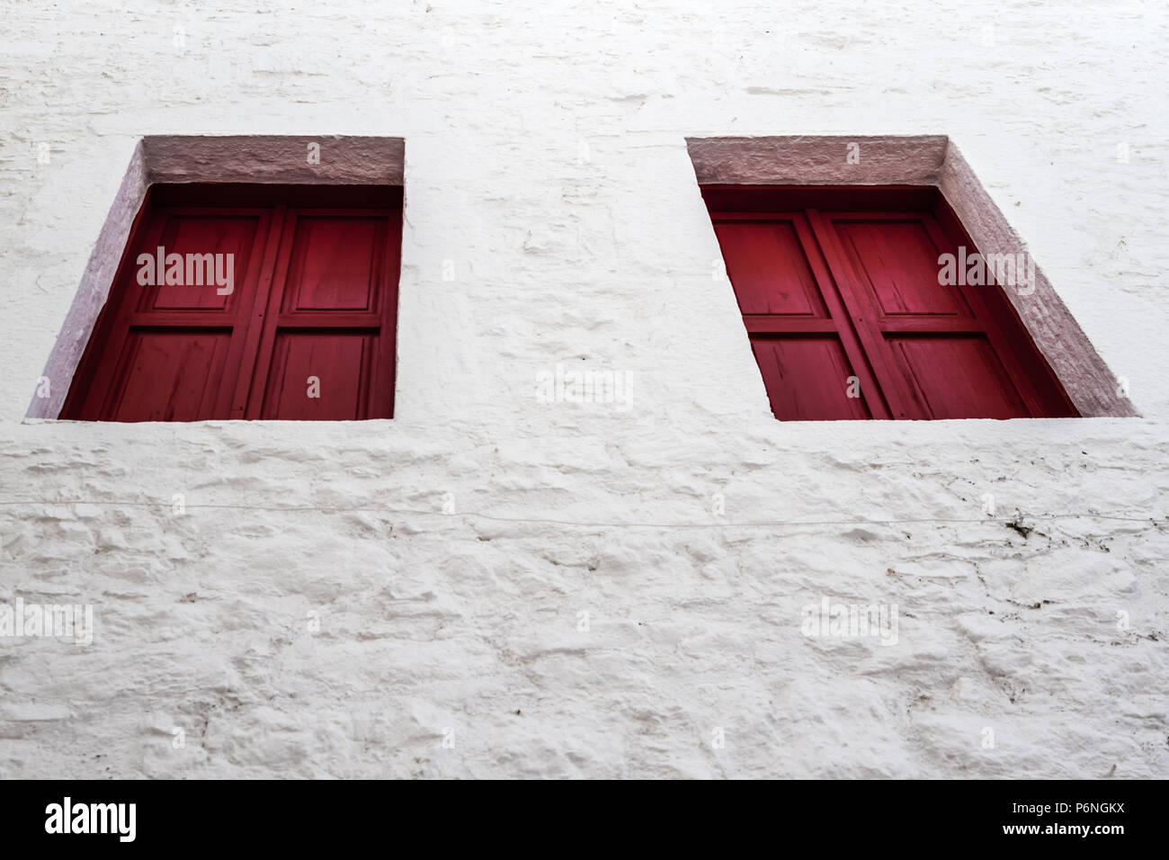 Traditional red wooden window shutters in Bodrum, Turkey Stock Photo
