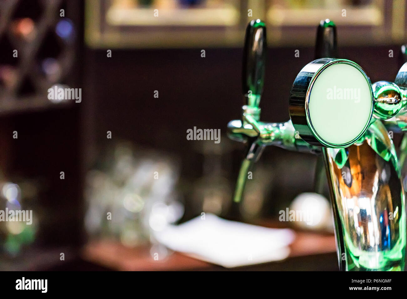 Chrome beer tap in modern bar Stock Photo