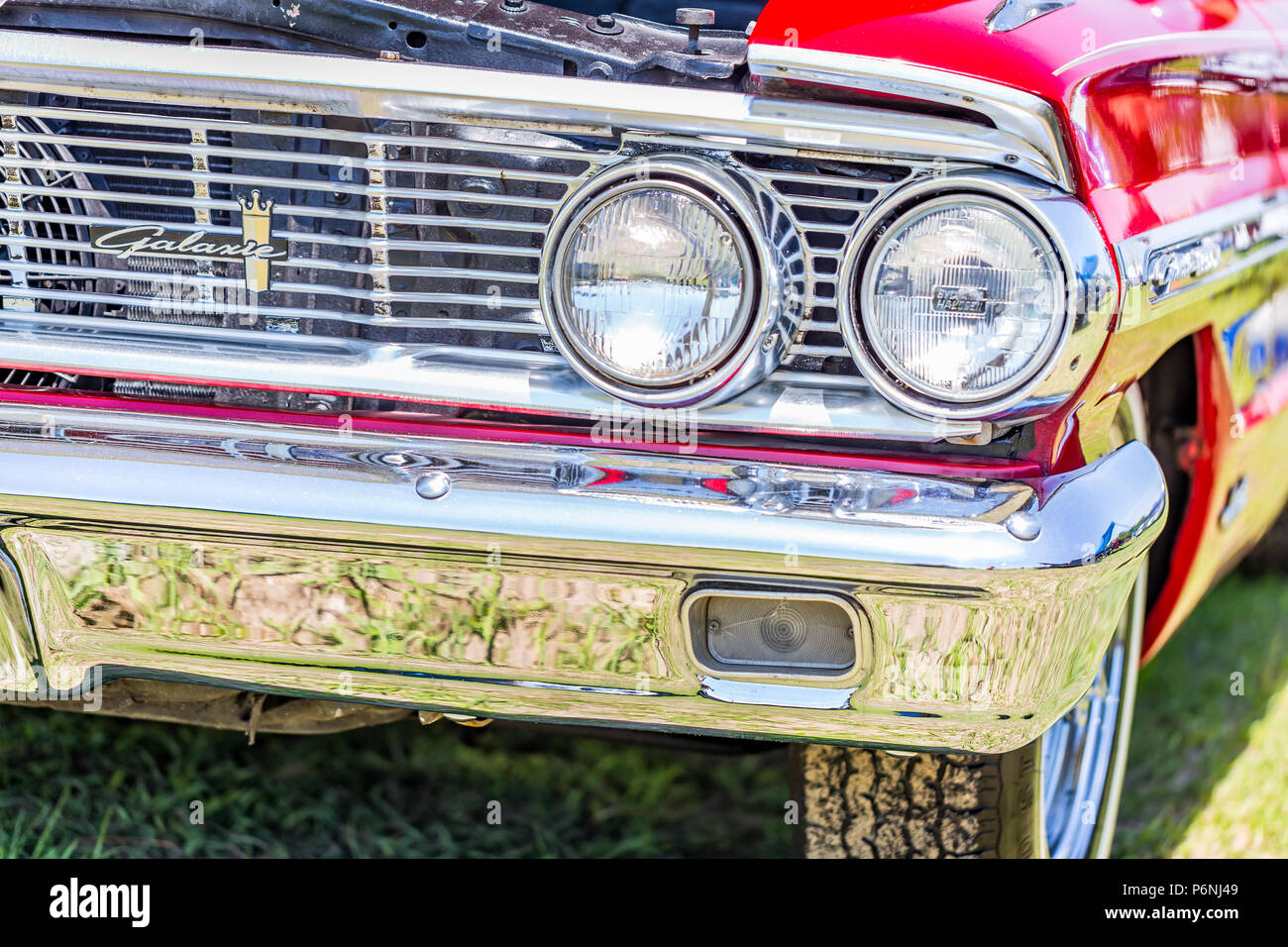 Shallow depth of field closeup of the front end details on a 1964 Ford Galaxie 500 XL convertible. Stock Photo