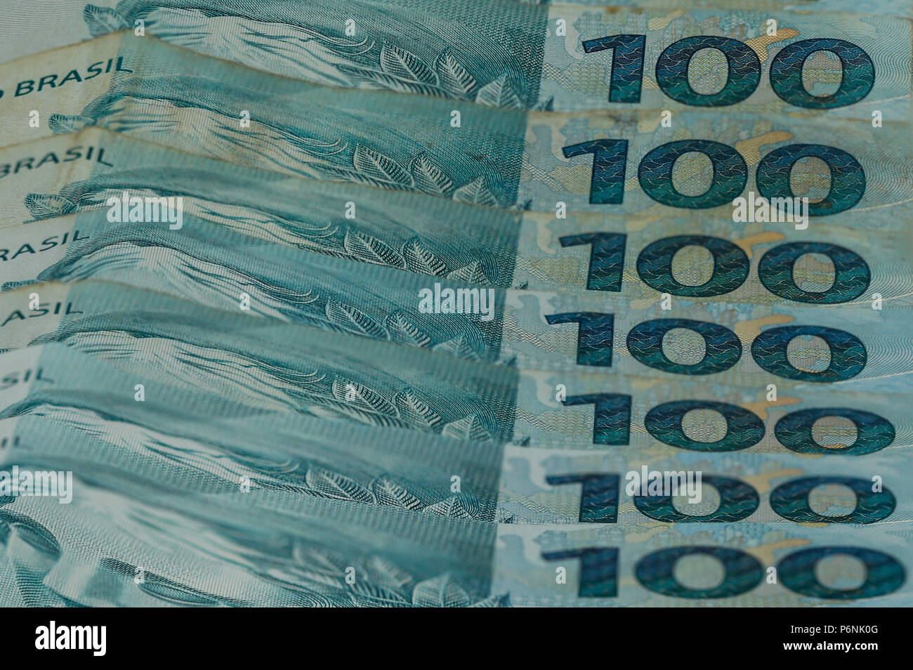 100 Real Money Notes from Brazil. Brazilian Money. Image of notes of Real, the official currency of Brazil since 1994. Notes of 100 Reais. Stock Photo