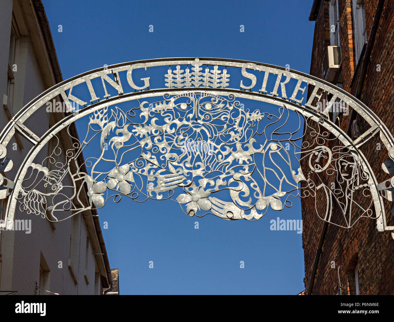 Ornate, galvanised metal arch street sign with tracery above King Street by artist Ben Coode-Adams, Melton Mowbray, Leicestershire, England, UK Stock Photo