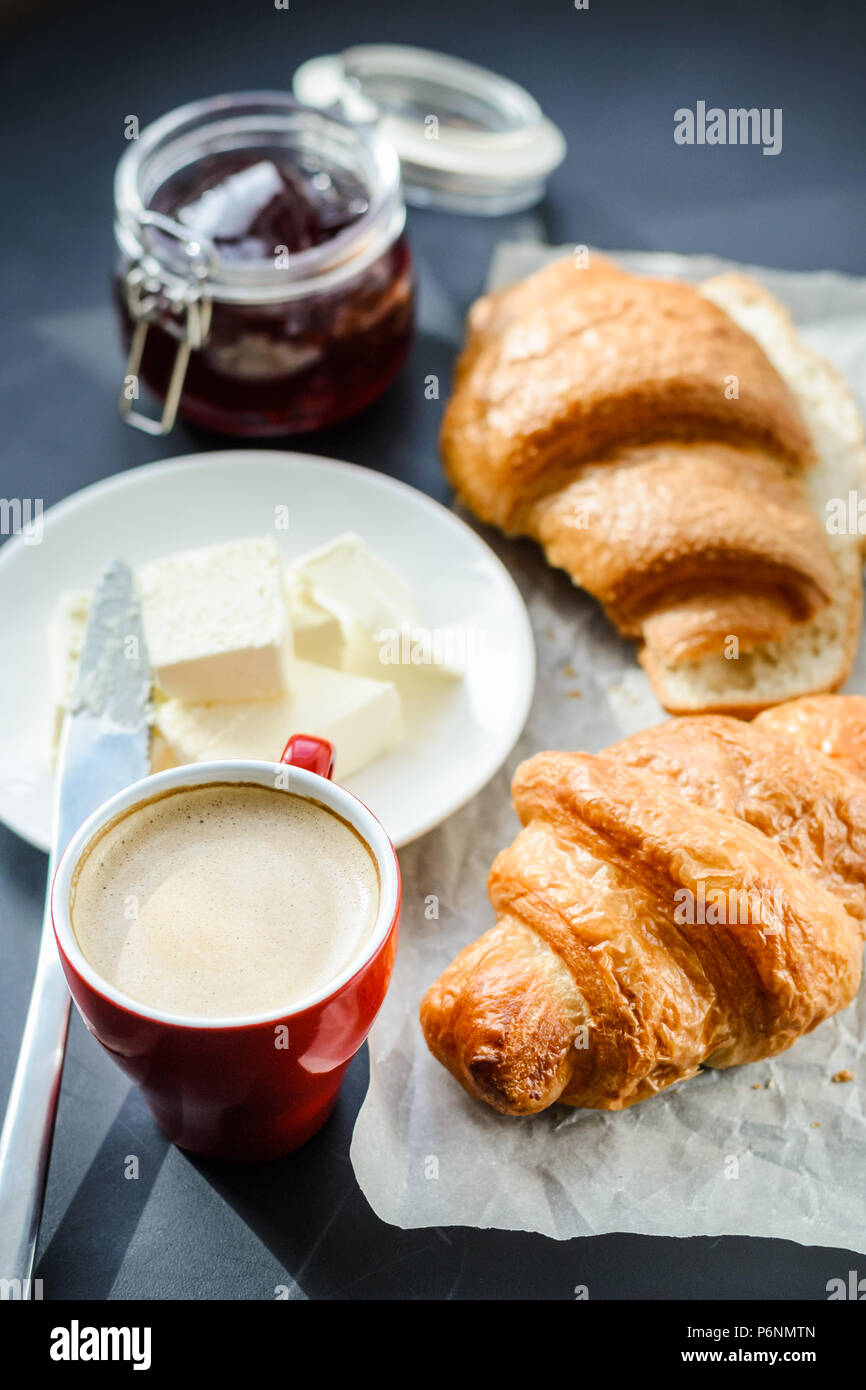 Croissant and a cup of tea French breakfast, Stock image