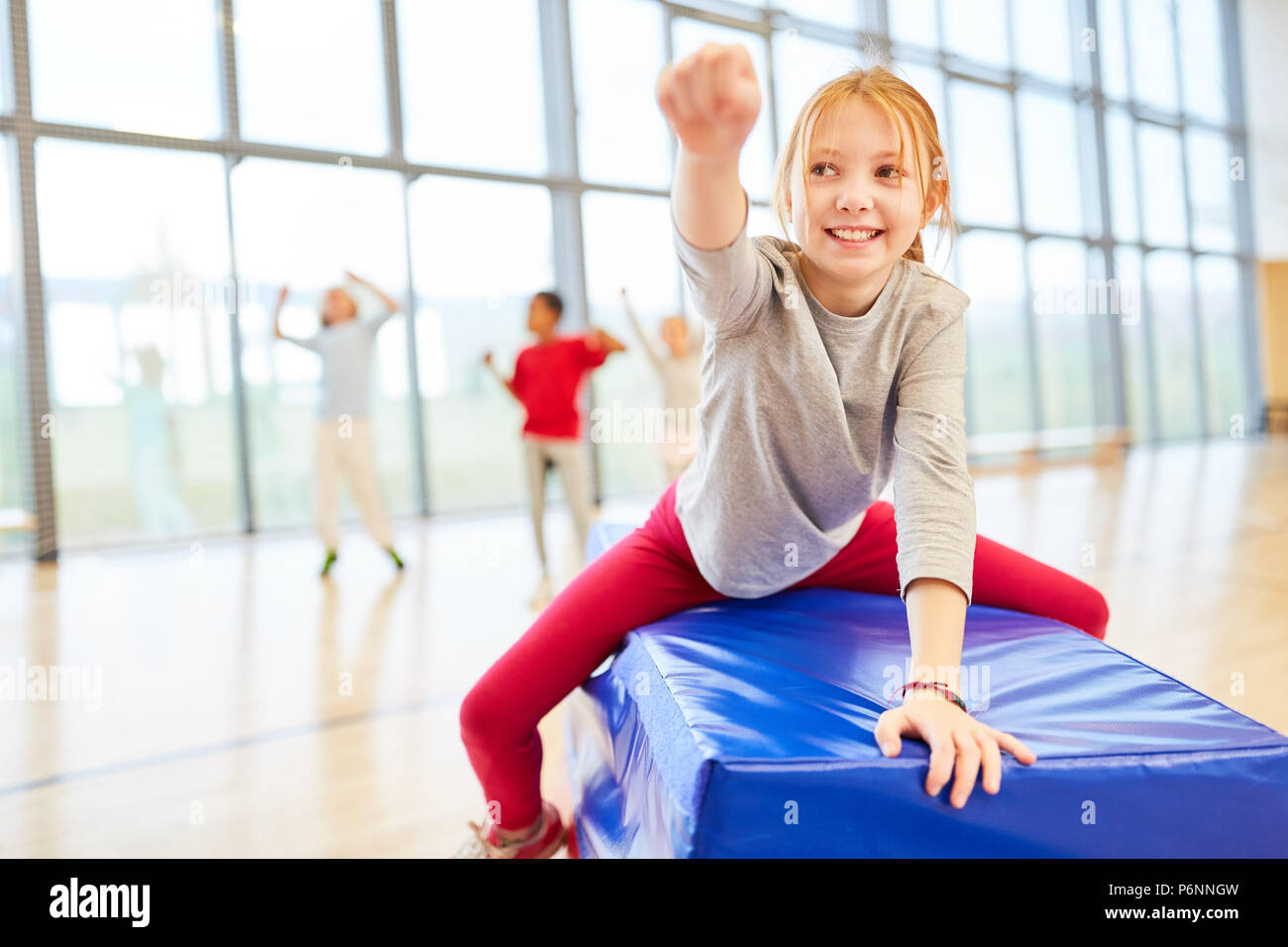 Sporty girl is having fun in physical education after a competition Stock Photo