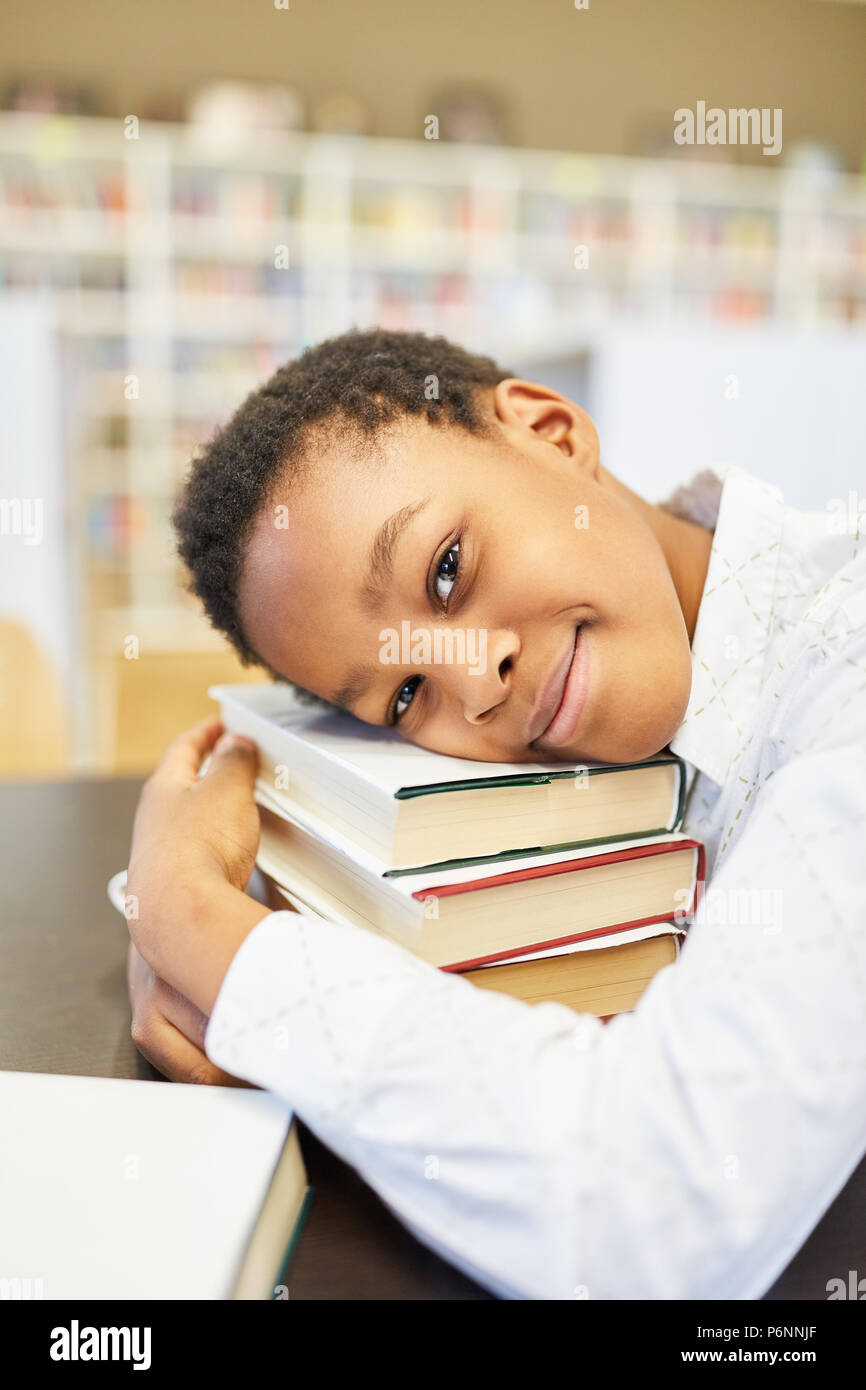 African student enjoys and relies on his books at school Stock Photo