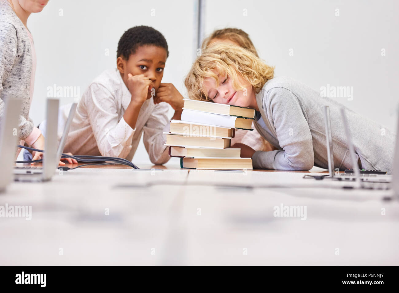 Group of kids does homework together in a primary school study group Stock Photo