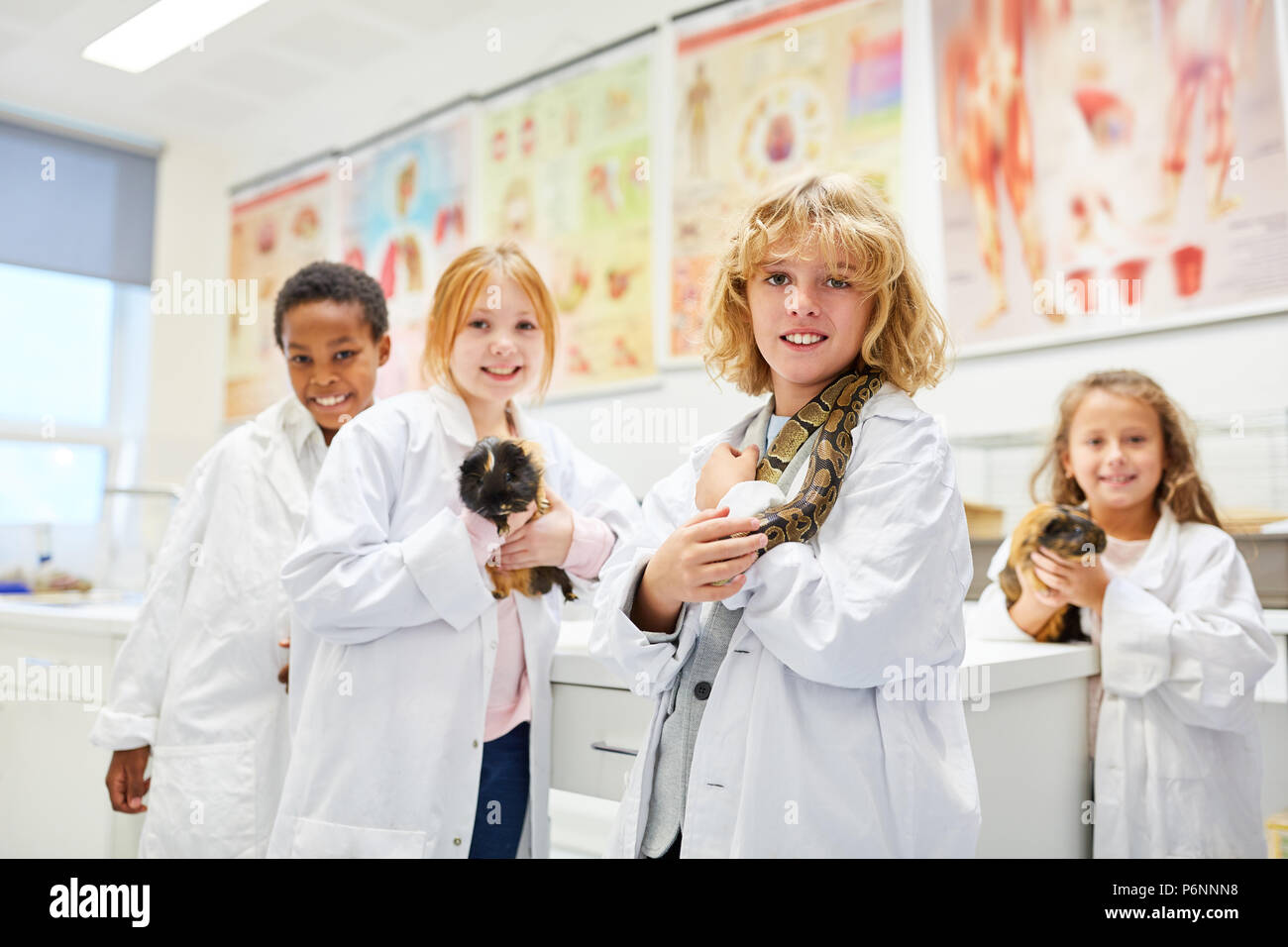 Students group of elementary school in biology research about animals
