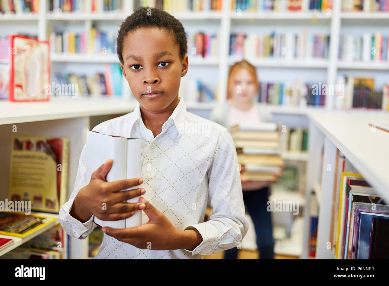 African pupil in the library of the school or a bookstore Stock Photo