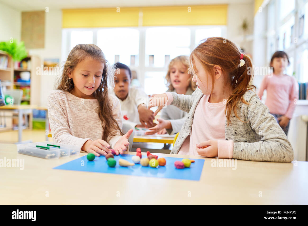 Children play and study together in a preschool or kindergarten Stock Photo