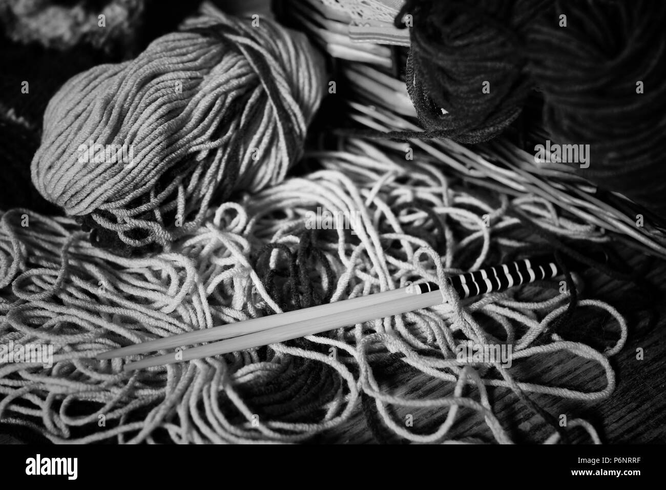 monochrome wool and knitting needles Stock Photo Alamy