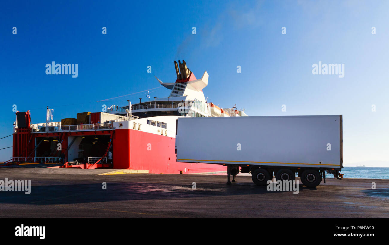 Ferry boat loading the truck on board in port. Semi-trailer with copy space. Stock Photo